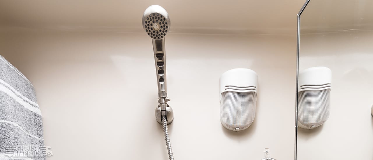 shower stall showing shower head that can be detached and held by hand