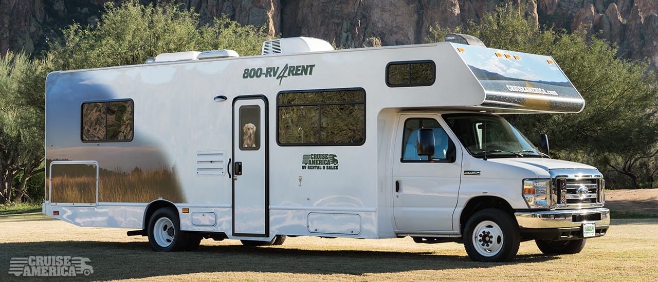 Front view of large RV, showing side with door.