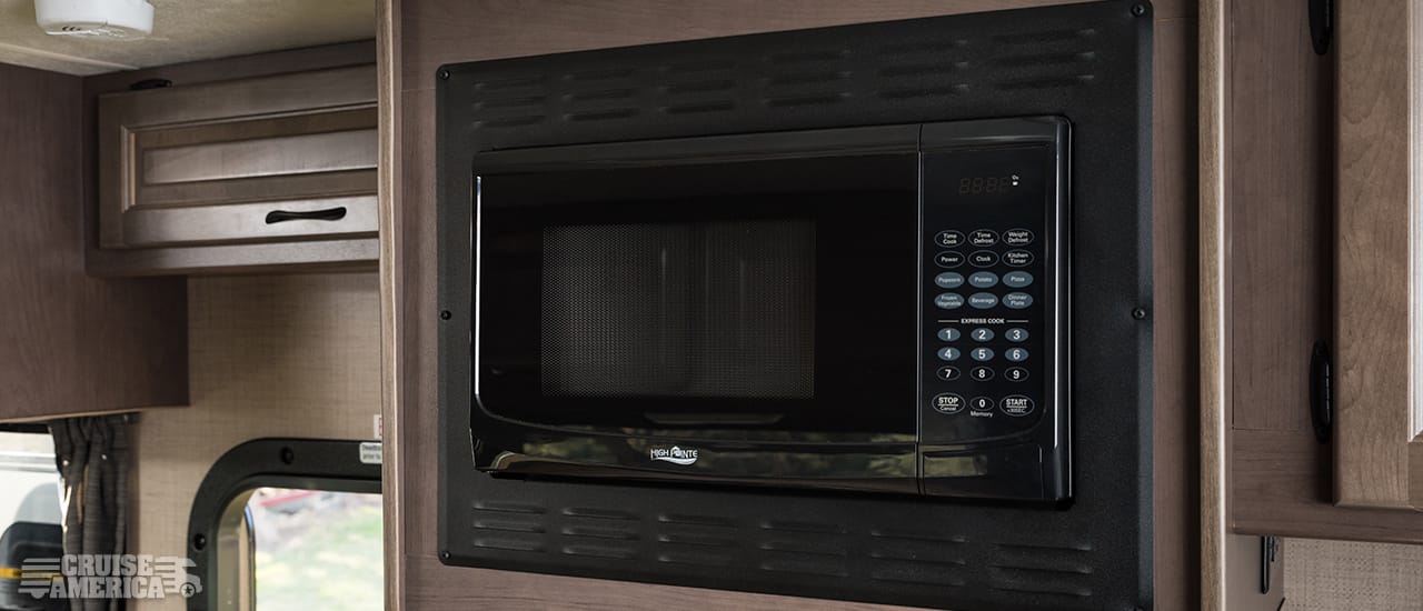 Microwave next to upper cabinet