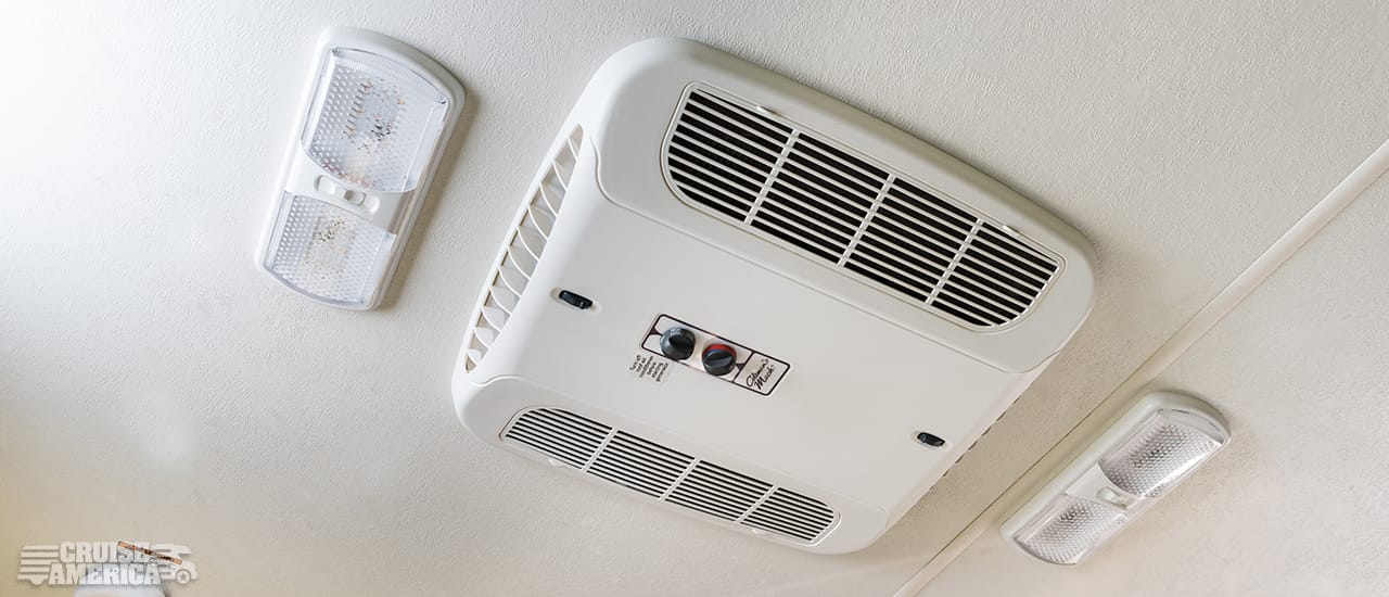 air conditioner vents and controls mounted on ceiling